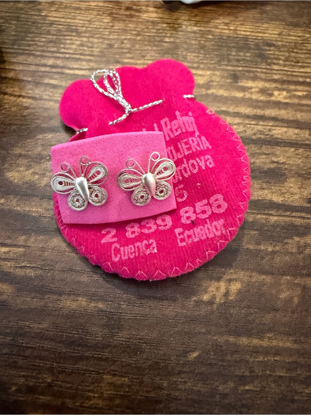 Silver Butterfly Stud Earrings on Pink Pouch